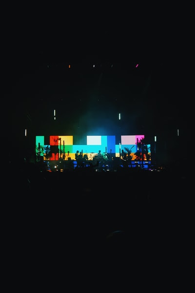 People stood on the stage in the night
